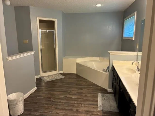a bathroom with a tub and toilet