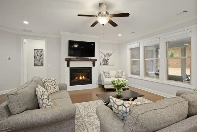 a living room with furniture and a flat screen tv