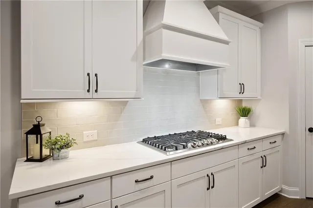 a bathroom with a sink a toilet and shower curtain