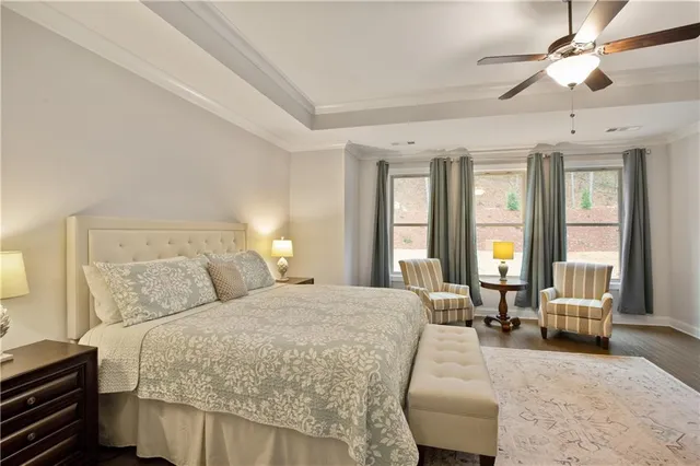 a view of a lake with a table and chairs