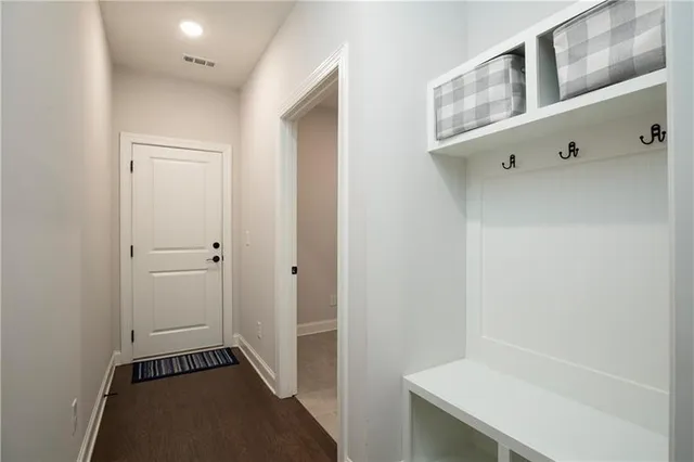 a front view of a house with a yard outdoor seating and garage