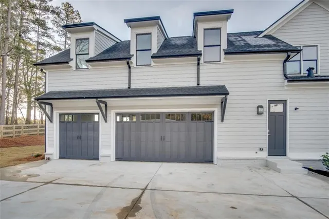 a front view of a house with garage