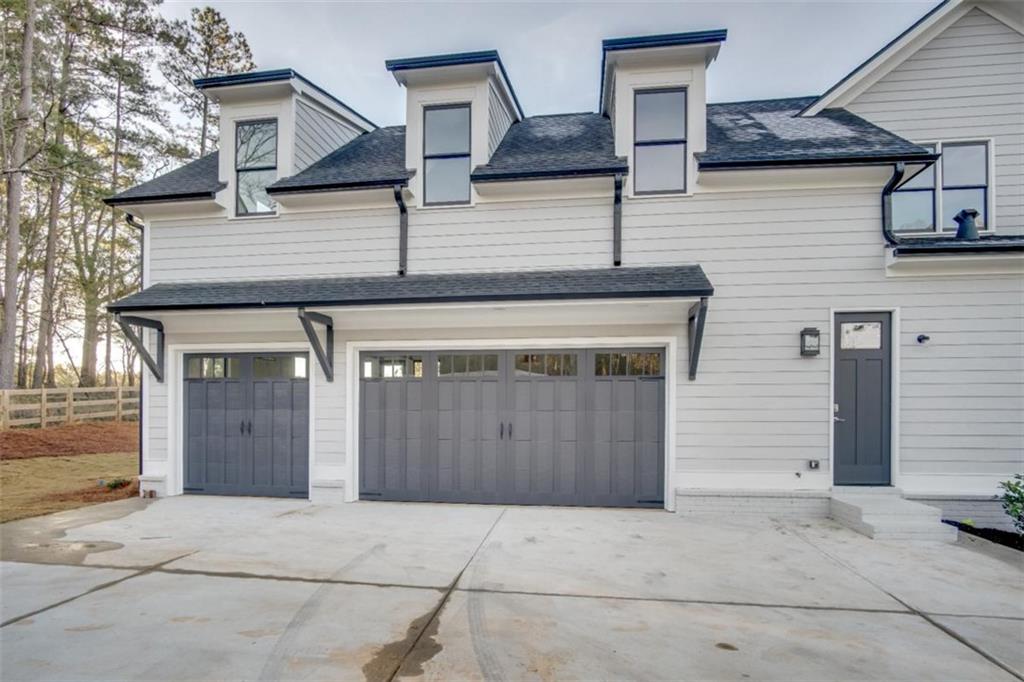 Lot 2 Cox Road Woodstock, GA 30188 - Photo 8 of 37 a front view of a house with garage