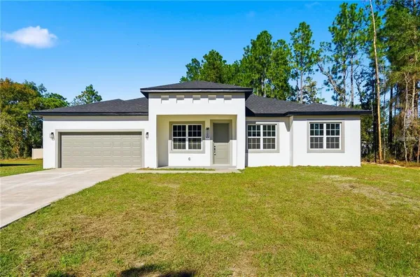 front view of a house with a yard