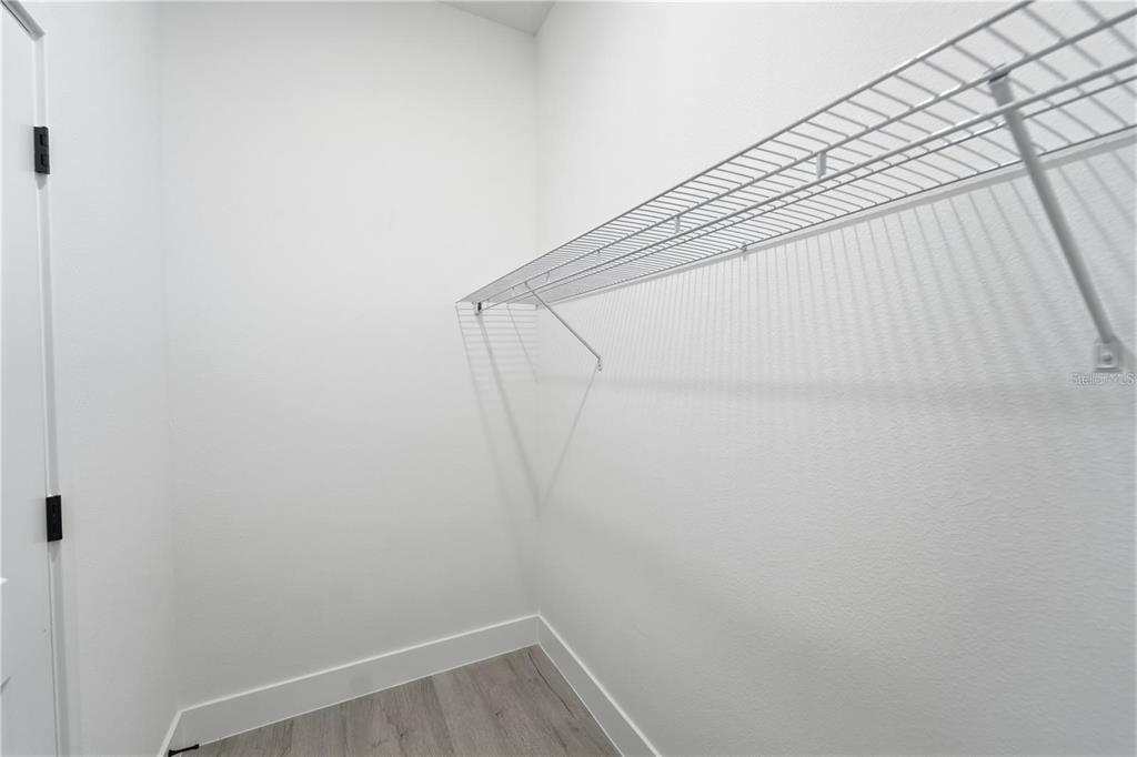 13205 Southwest 65th Circle Ocala, FL 34473 - Photo 25 of 32 a view of small space with racks on wall and a window