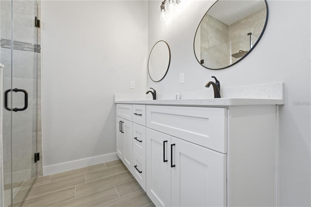 13205 Southwest 65th Circle Ocala, FL 34473 - Photo 26 of 32 a bathroom with a sink and a mirror