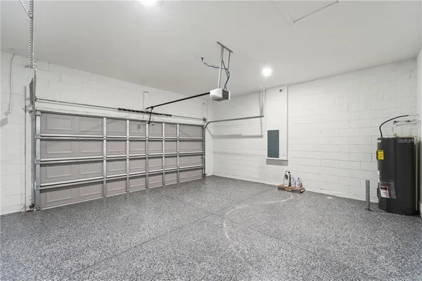 a view of a room with gym equipment and a window