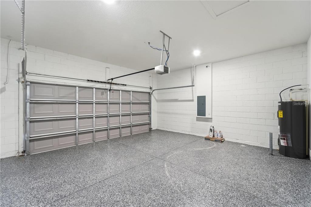 13205 Southwest 65th Circle Ocala, FL 34473 - Photo 29 of 32 a view of a room with gym equipment and a window