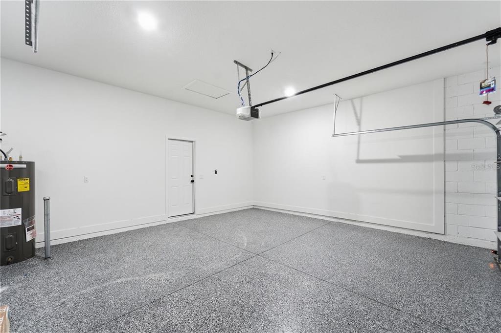 13205 Southwest 65th Circle Ocala, FL 34473 - Photo 30 of 32 a view of a room with racks on the wall
