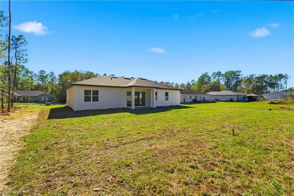 a view of a house with a big yard