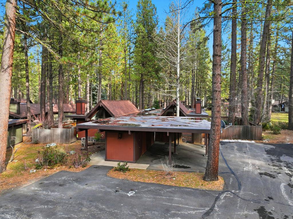 a view of backyard with table and chairs and couches