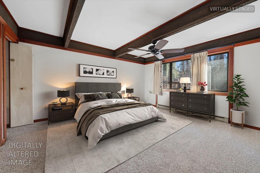 39 Graeagle Meadows Road Graeagle, CA 96103 - Photo 18 of 51 a spacious bedroom with a bed a dresser and paintings on the wall