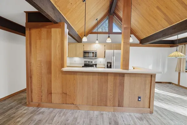 a view of kitchen and wooden floor