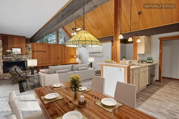 a living room with furniture and a table