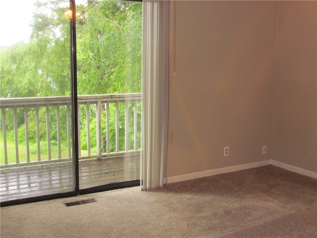 25 Anchor Point, Unit POINTE Anderson, SC 29625 - Photo 8 of 20 Master Bedroom with Balcony and view of the lake