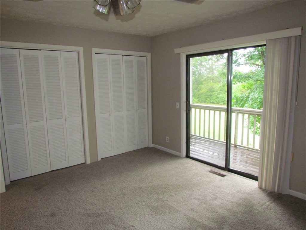 25 Anchor Point, Unit POINTE Anderson, SC 29625 - Photo 9 of 20 Master Bedroom with balcony view of the lake
