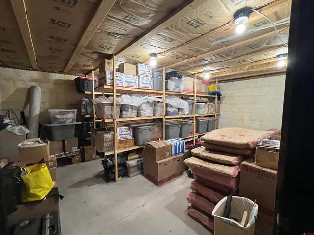 a living room with red chairs