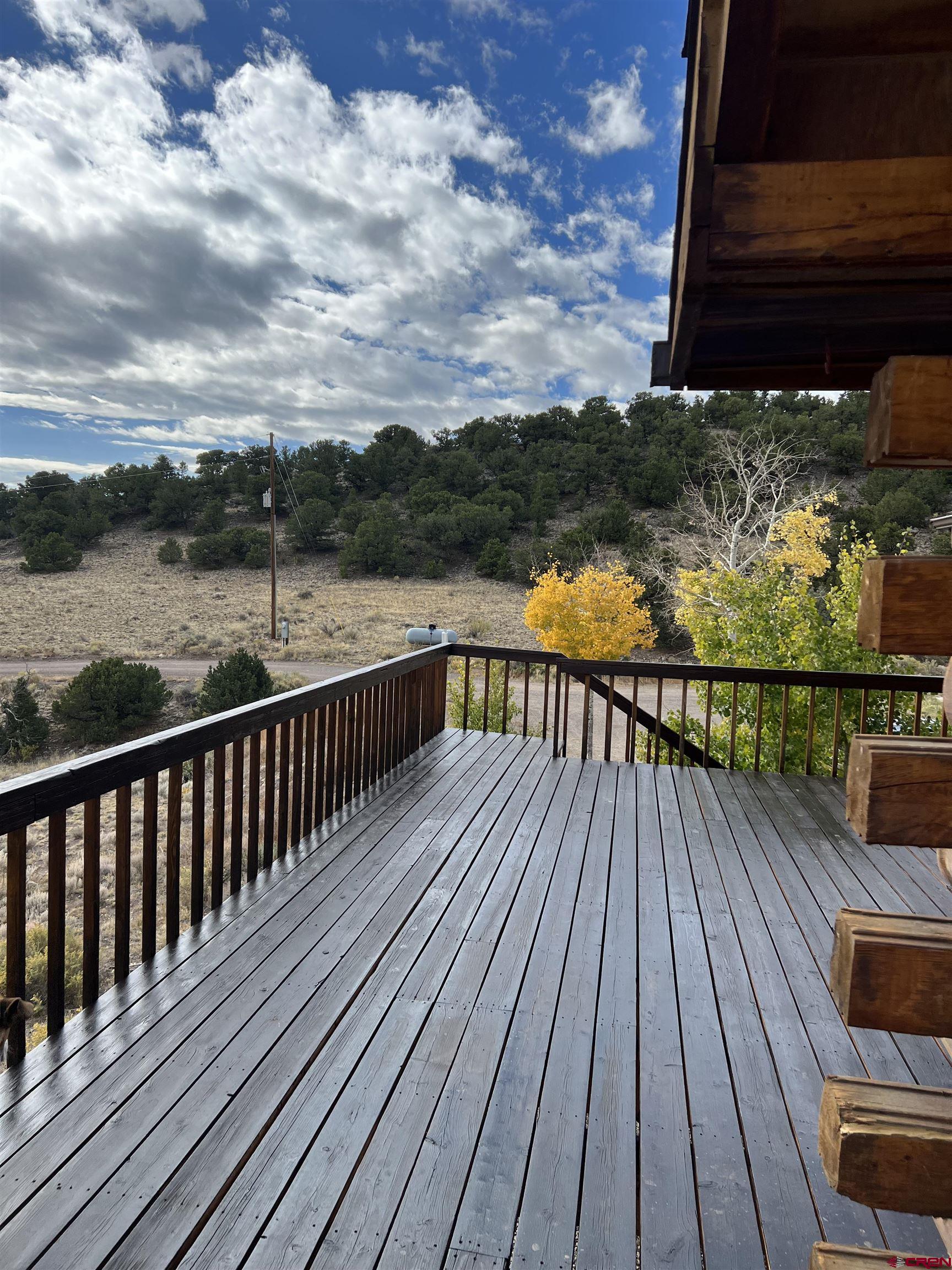 41400 Co Road Saguache, CO 81149 - Photo 33 of 45 a view of balcony with wooden floor and fence