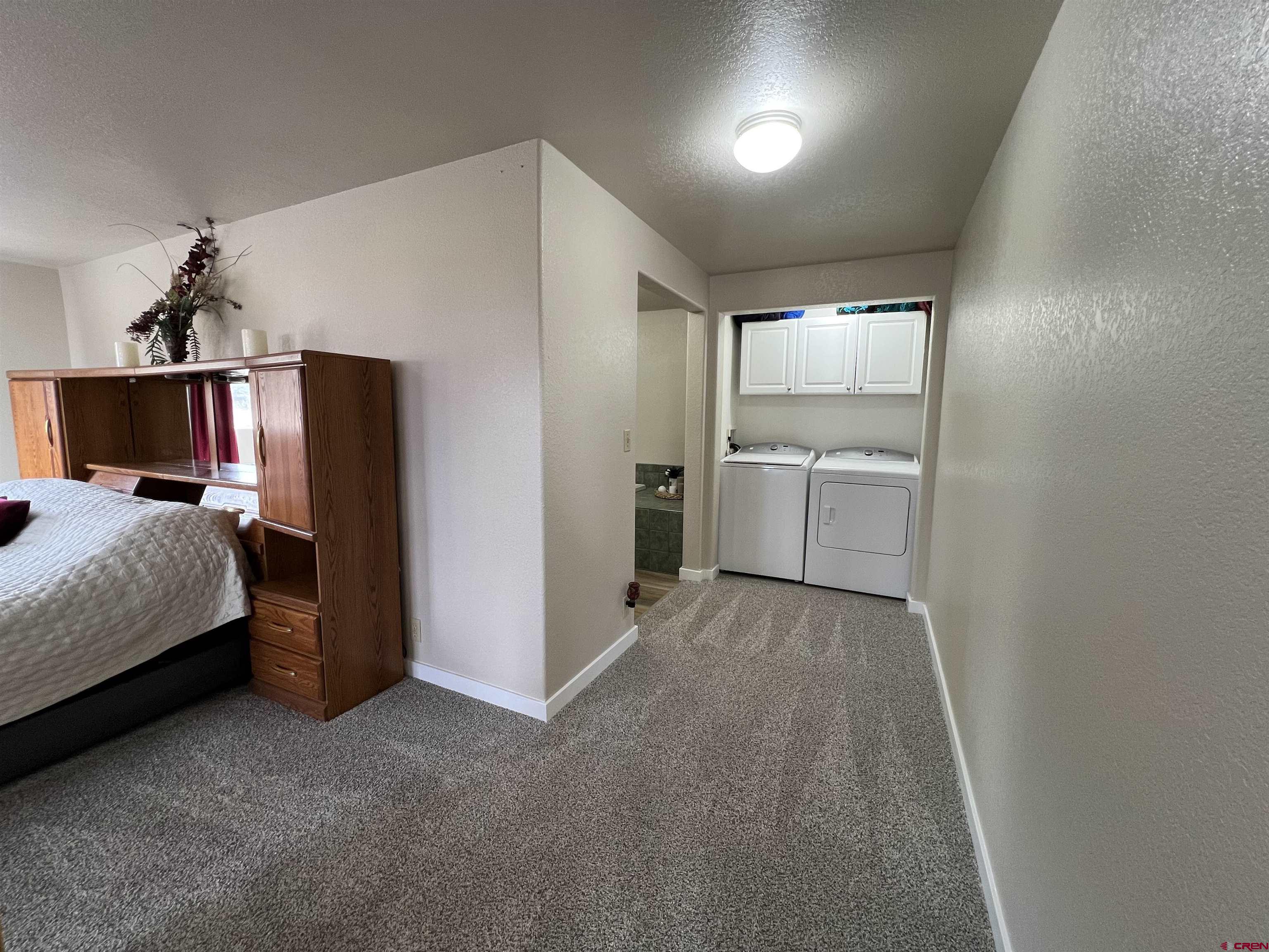 41400 Co Road Saguache, CO 81149 - Photo 10 of 45 a room with a bed and a walk in closet