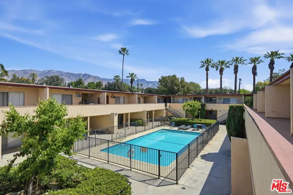 a view of a balcony with chairs