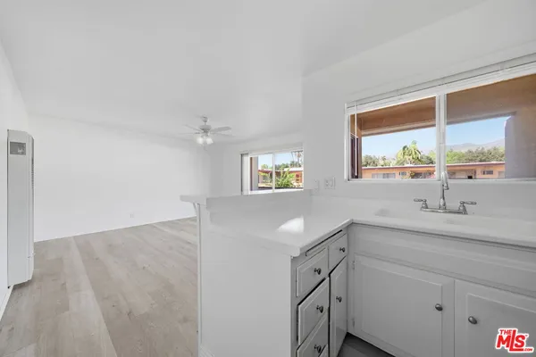 a bathroom with a sink and a window