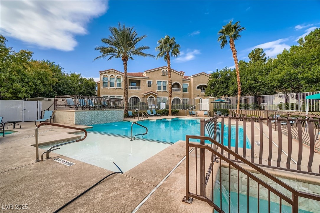10001 Peace Way, Unit 2352 Las Vegas, NV 89147 - Photo 22 of 24 Community pool with a patio area