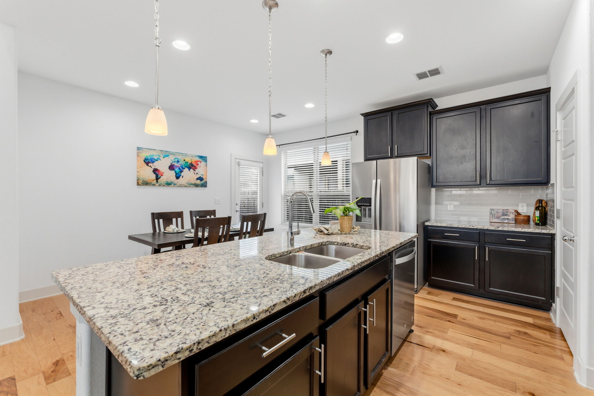 1007 Totis Road Austin, TX 78748 - Photo 11 of 37 a kitchen with granite countertop kitchen island a sink appliances and a counter space