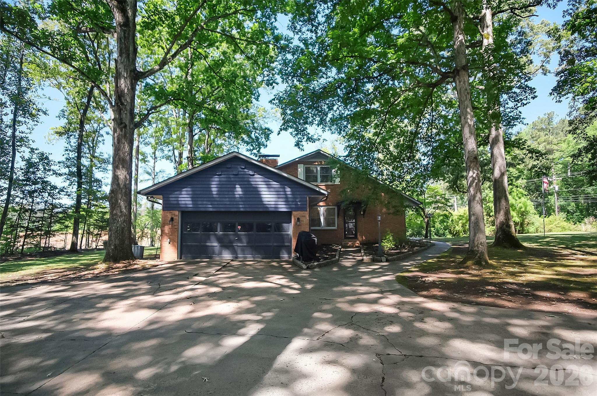 808 Old Mt Holly Road Stanley, NC 28164 - Photo 4 of 48 a front view of a house with a yard