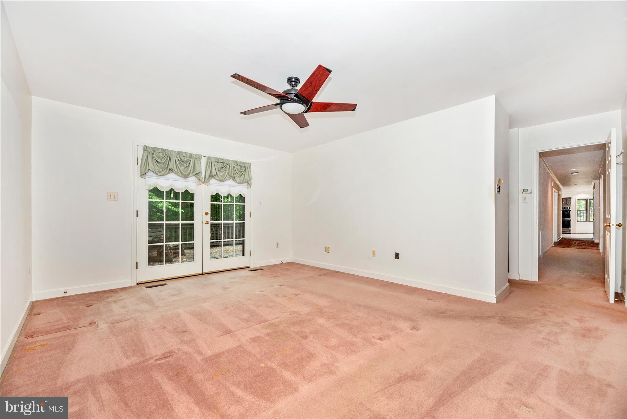 2221 Gold Mine Road Brookeville, MD 20833 - Photo 28 of 60 a view of a livingroom with a ceiling fan and window