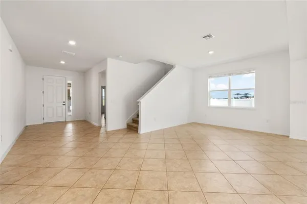 a view of an empty room with a window