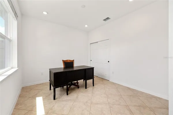 a view of a hallway with white walls