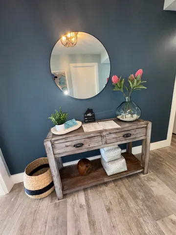 a living room with furniture and a chair