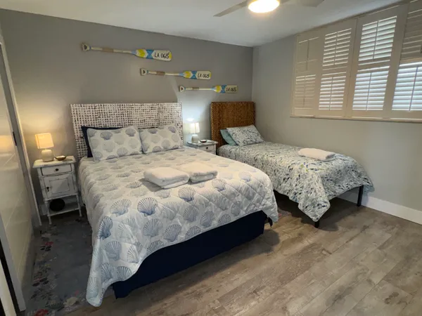 a bedroom with double bed and window