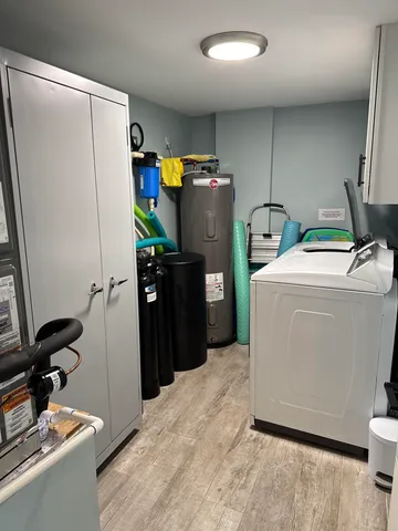 a room with refrigerator and washer