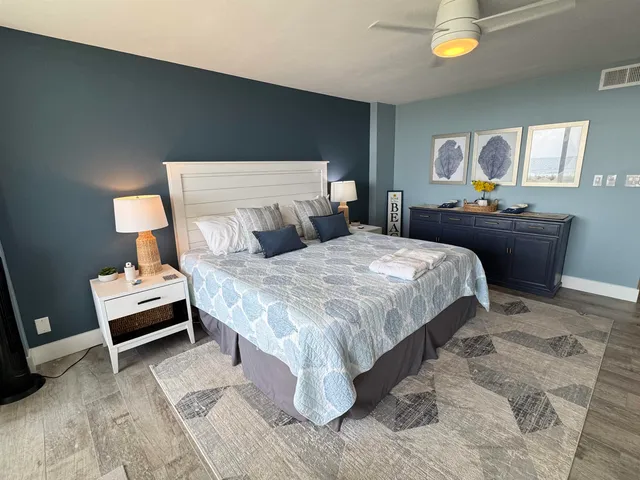 a bedroom with a bed and a table