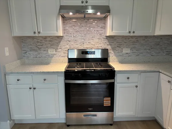 a bathroom with a toilet a sink and a mirror