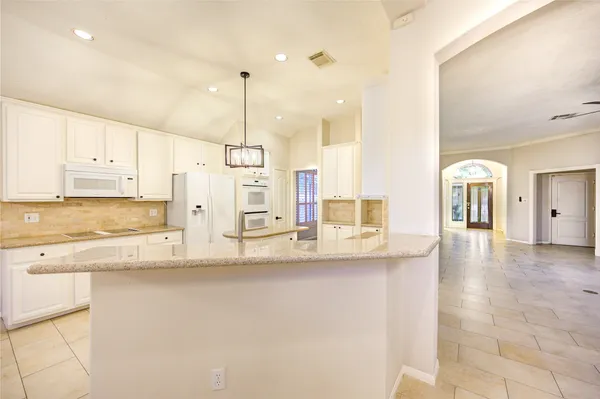 a view of a kitchen with a sink and a window