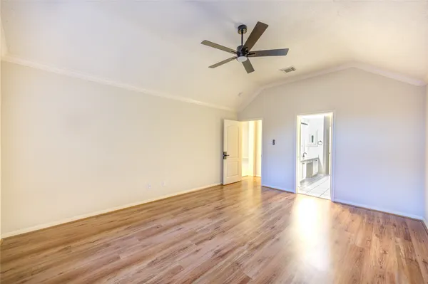 a spacious bathroom with a sink a large mirror and a shower