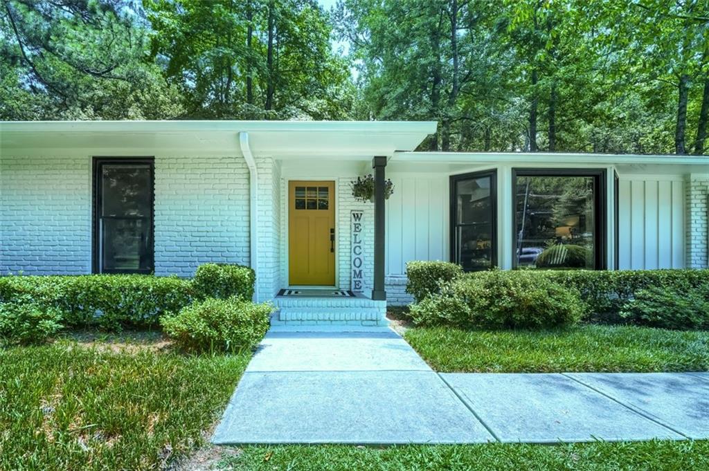 front view of a house with a yard