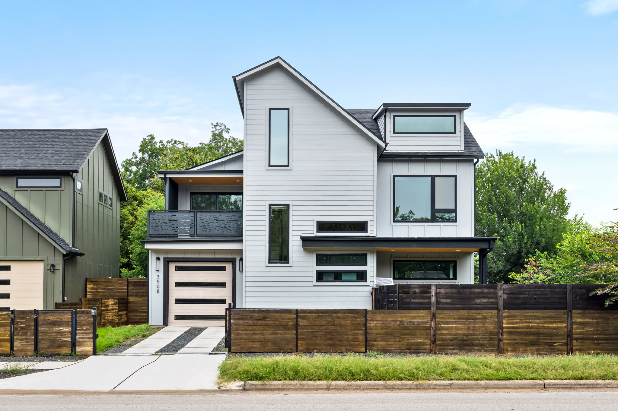 3508 Lyons Road Austin, TX 78702 - Photo 1 of 40 A striking contemporary residence boasts clean lines and a charming upper-level balcony, complementing its modern design.