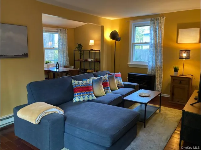 a living room with furniture and a window