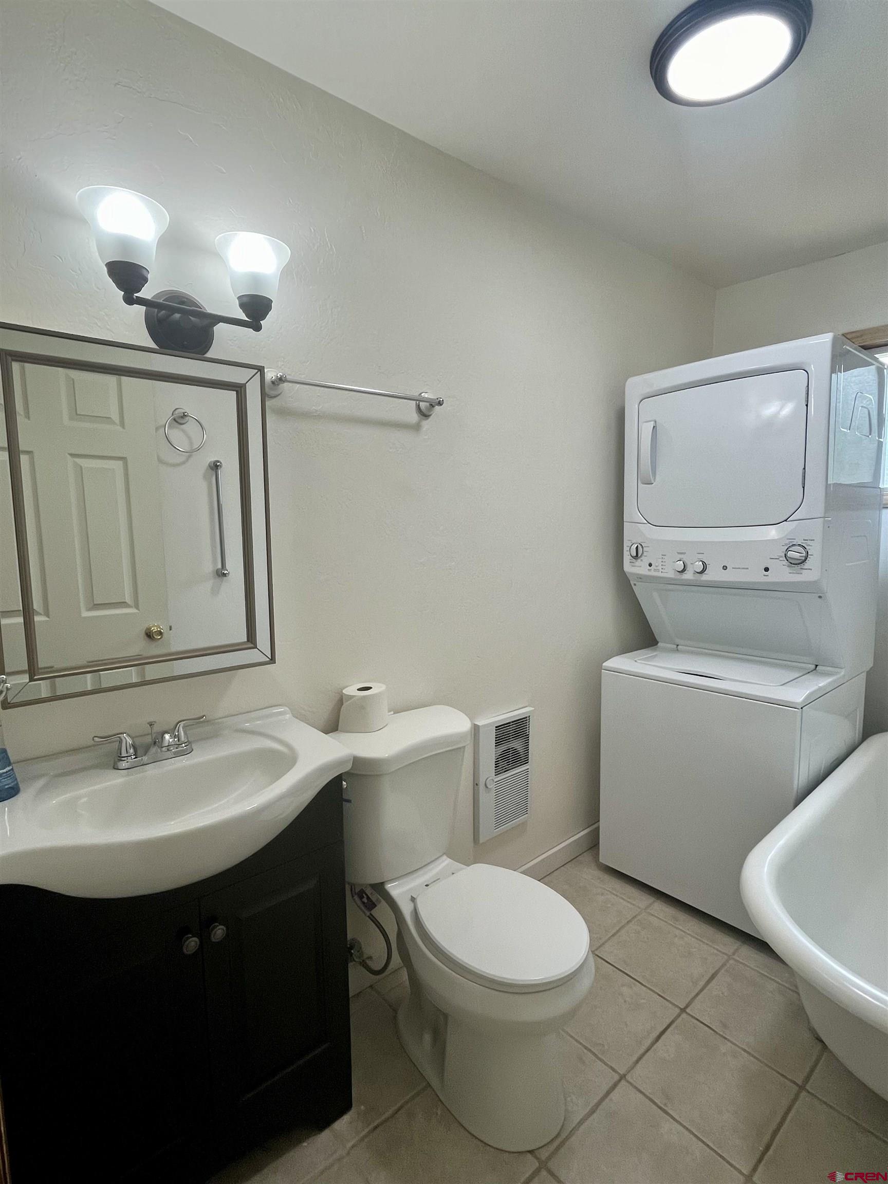 1039 Silver Mesa Driveway Durango, CO 81301 - Photo 19 of 35 a bathroom with a sink a toilet and mirror