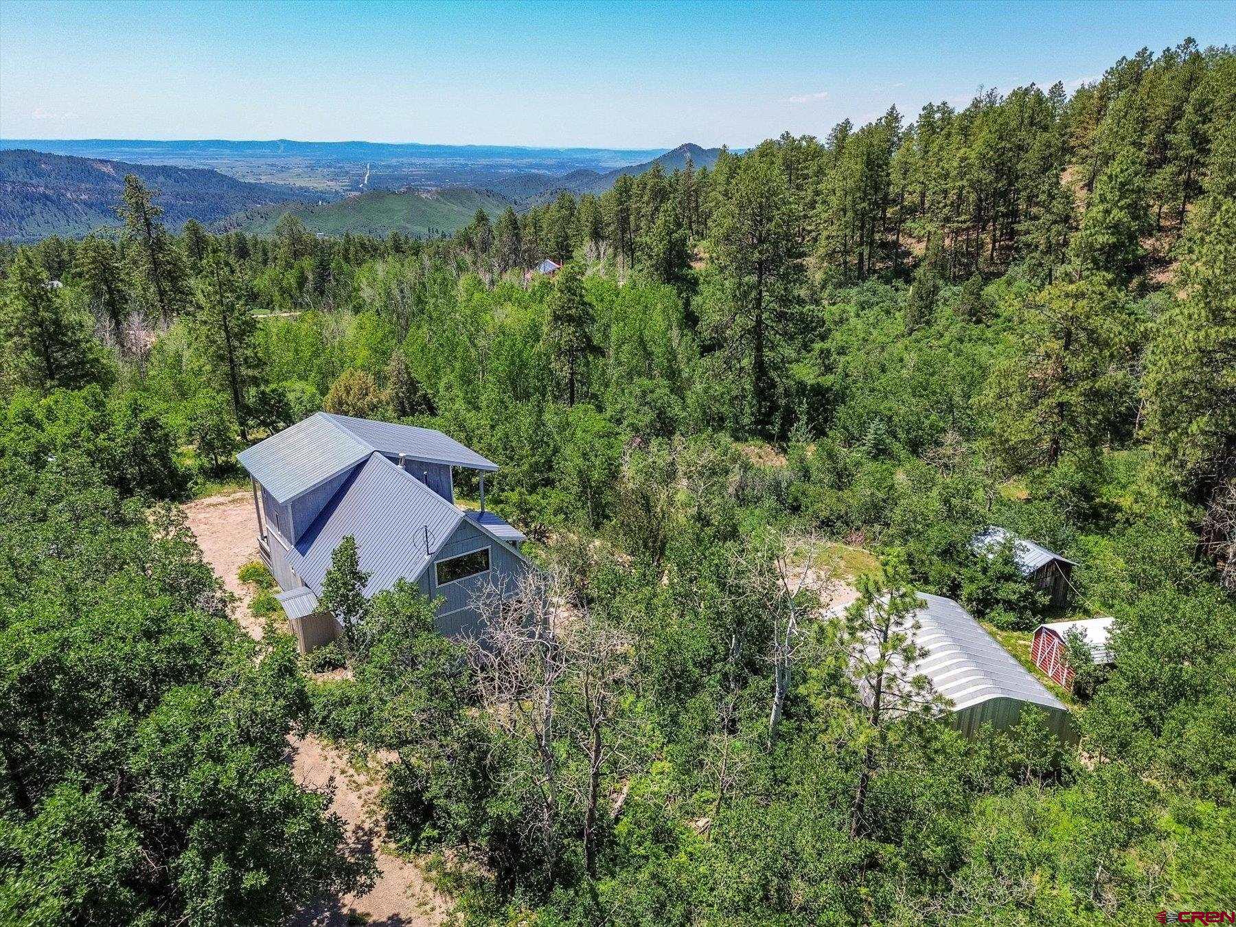 1039 Silver Mesa Driveway Durango, CO 81301 - Photo 2 of 35 an aerial view of a house with mountain view