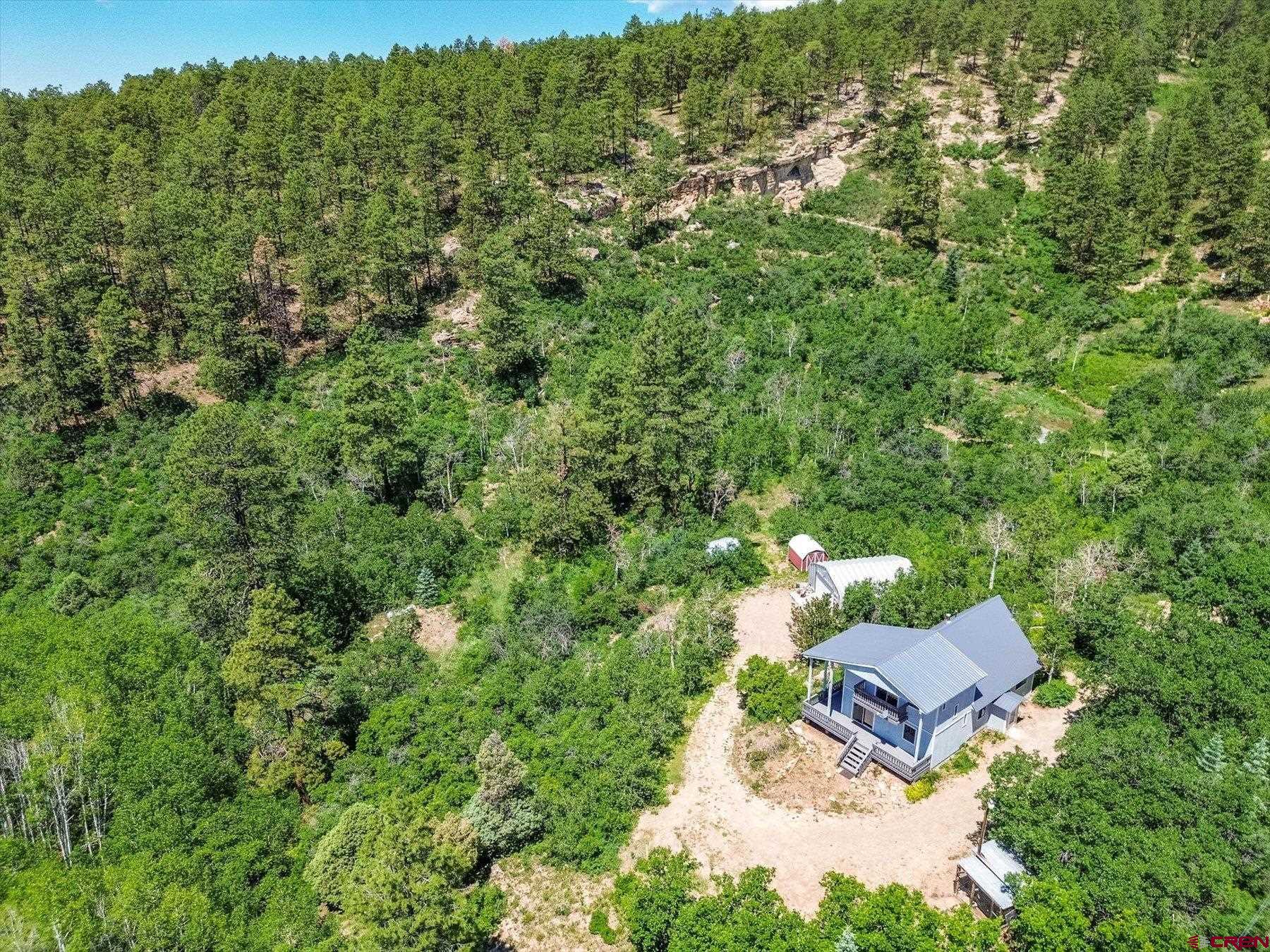1039 Silver Mesa Driveway Durango, CO 81301 - Photo 28 of 35 an aerial view of a house with a yard