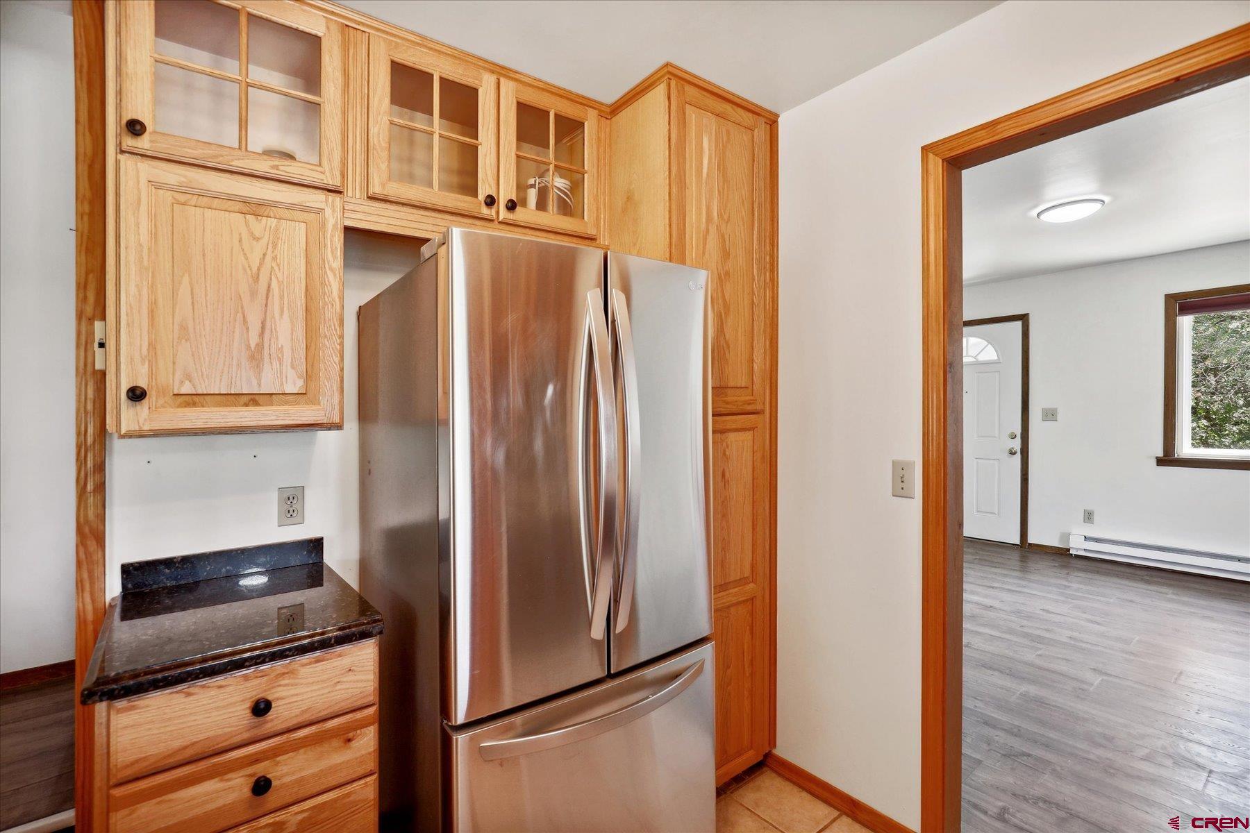 1039 Silver Mesa Driveway Durango, CO 81301 - Photo 8 of 35 a kitchen with stainless steel appliances a refrigerator and cabinets
