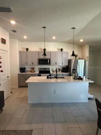 a large kitchen with cabinets
