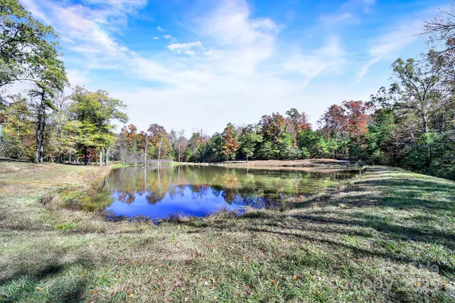 a view of a lake with houses in the back