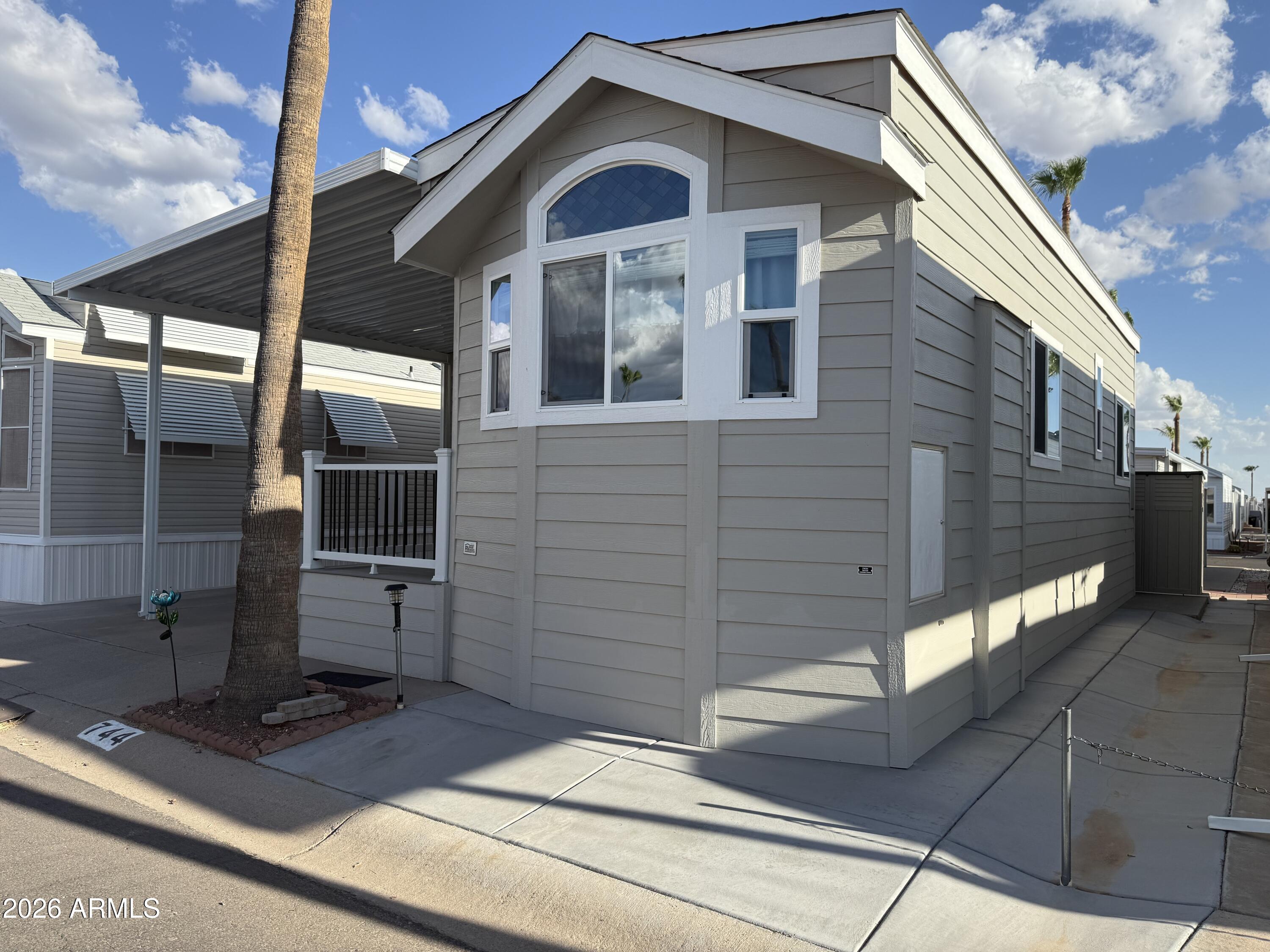 a view of front door and potted plants