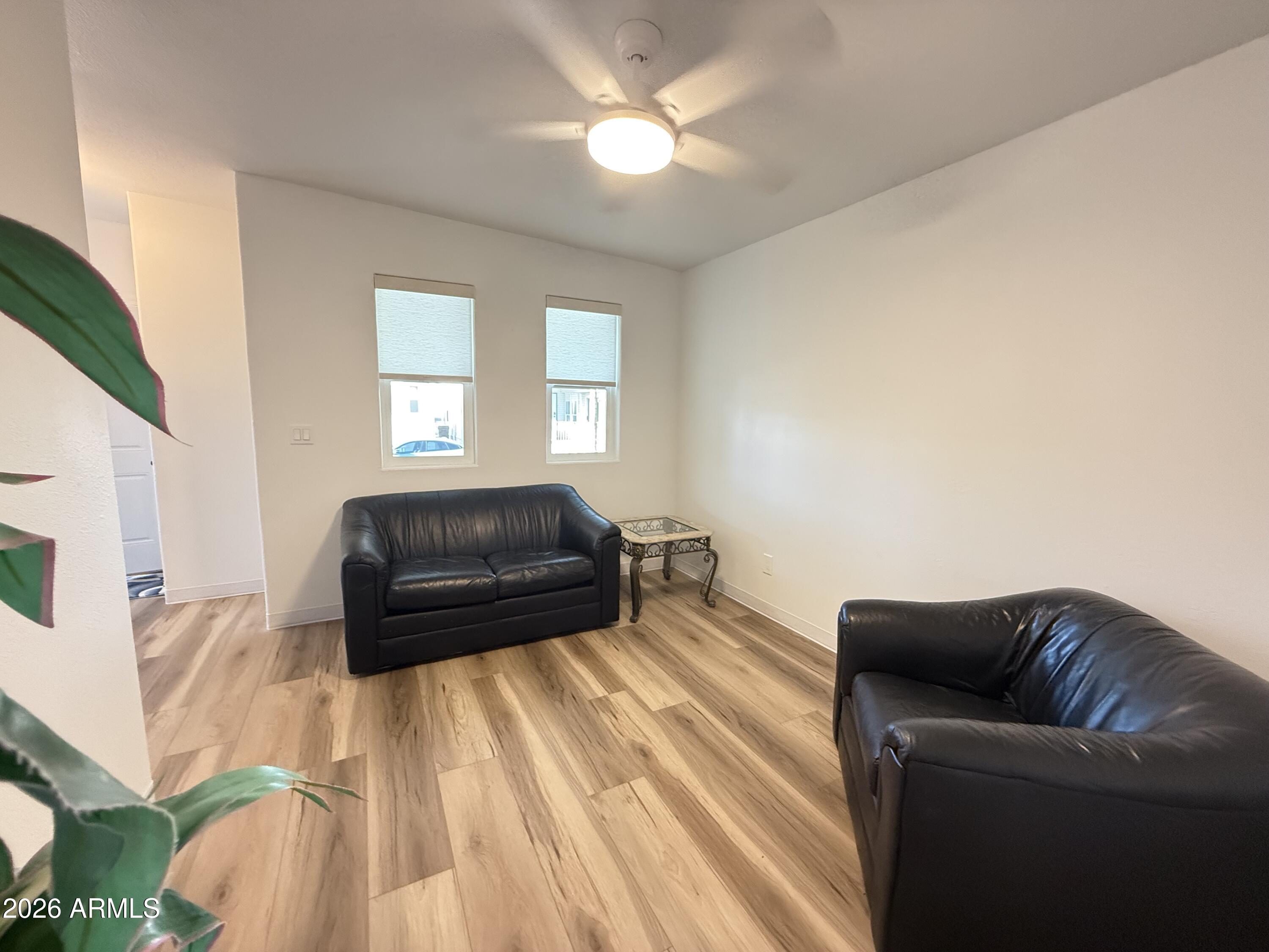 744 Emerald Drive Apache Junction, AZ 85119 - Photo 15 of 25 a living room with a couch and a chandelier