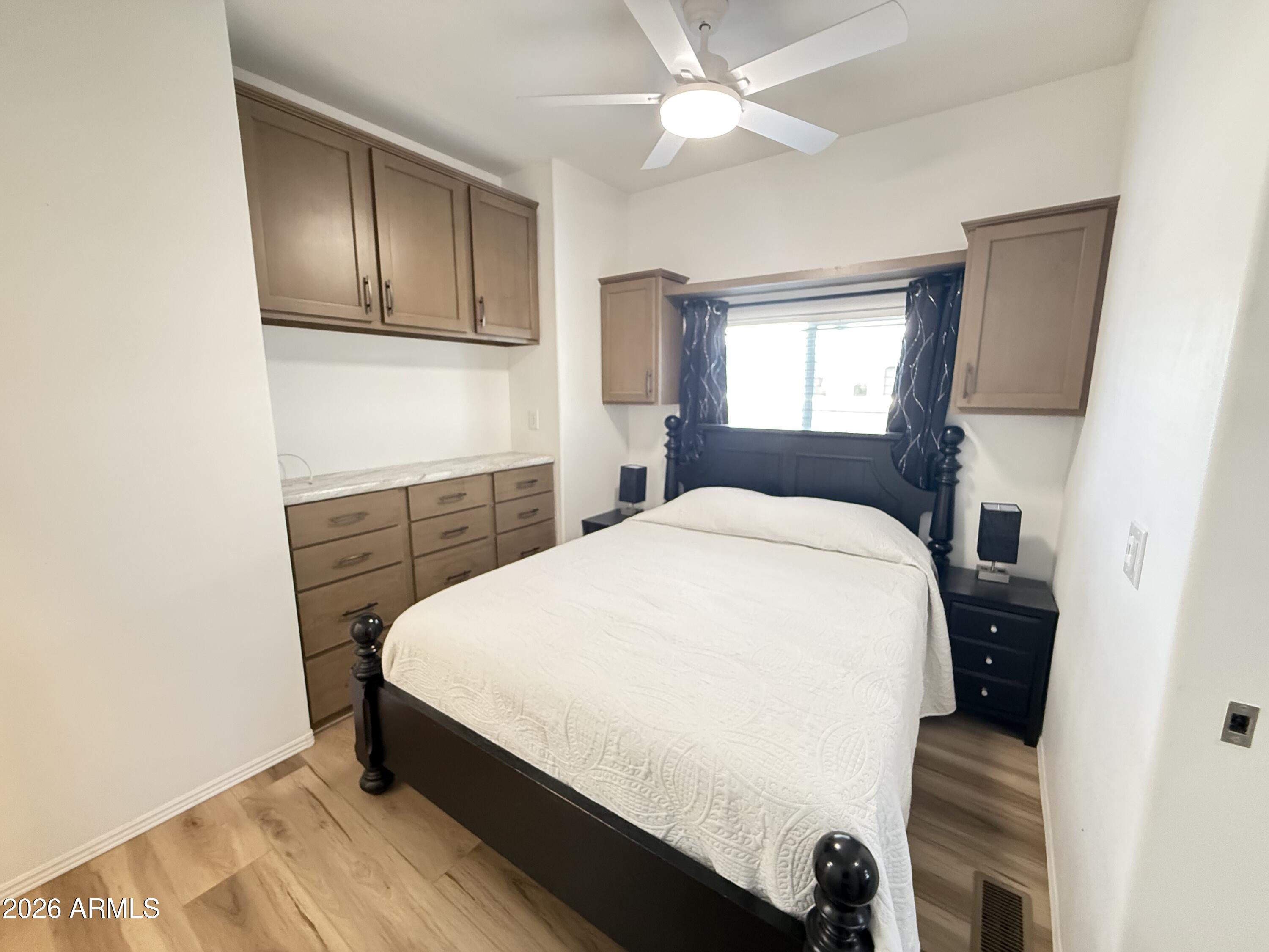 744 Emerald Drive Apache Junction, AZ 85119 - Photo 20 of 25 a bed sitting in a bedroom next to a window